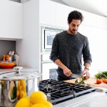 man cutting vegetables