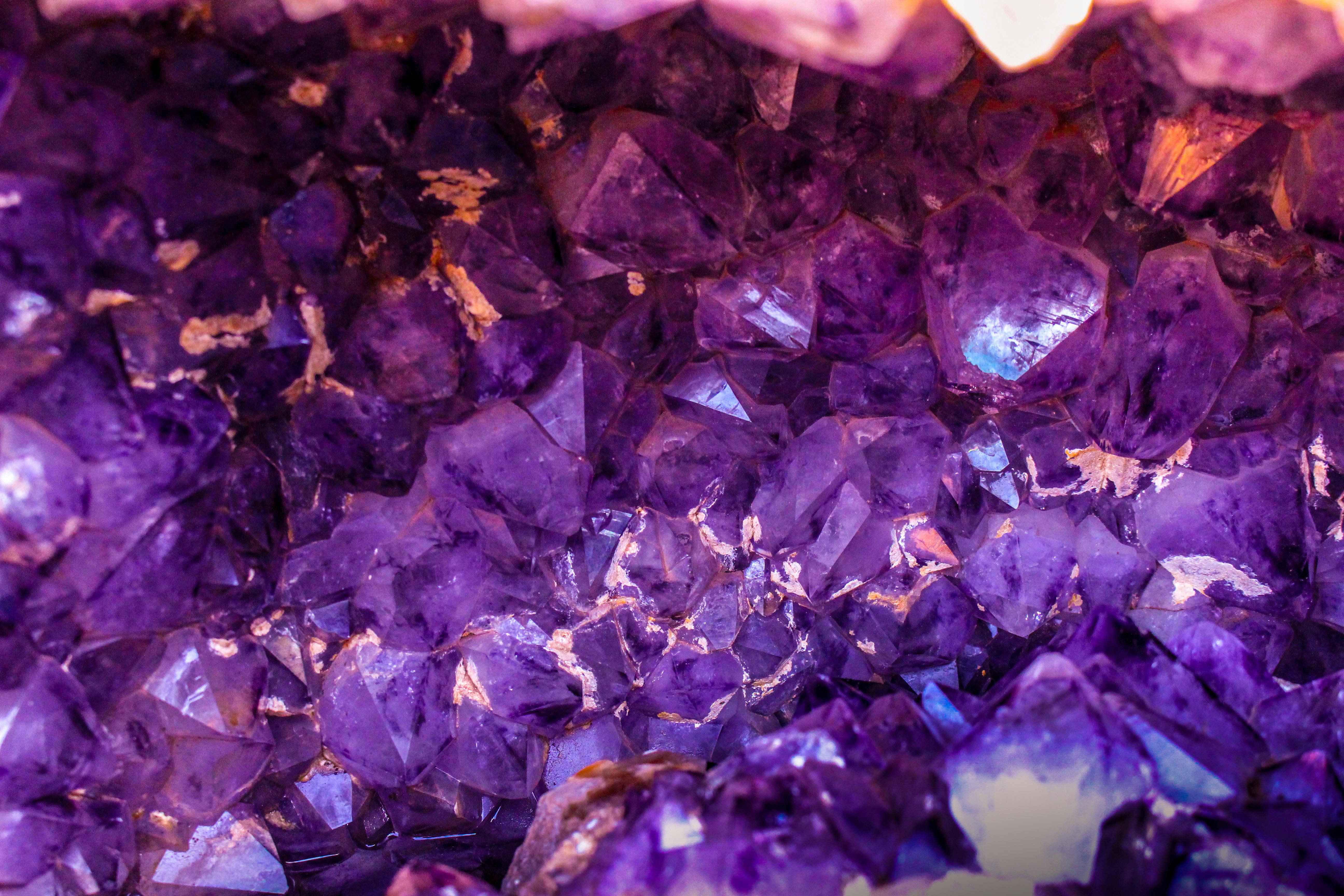 Close-up view of a beautiful amethyst crystal cluster showcasing its vibrant purple hues and natural texture.