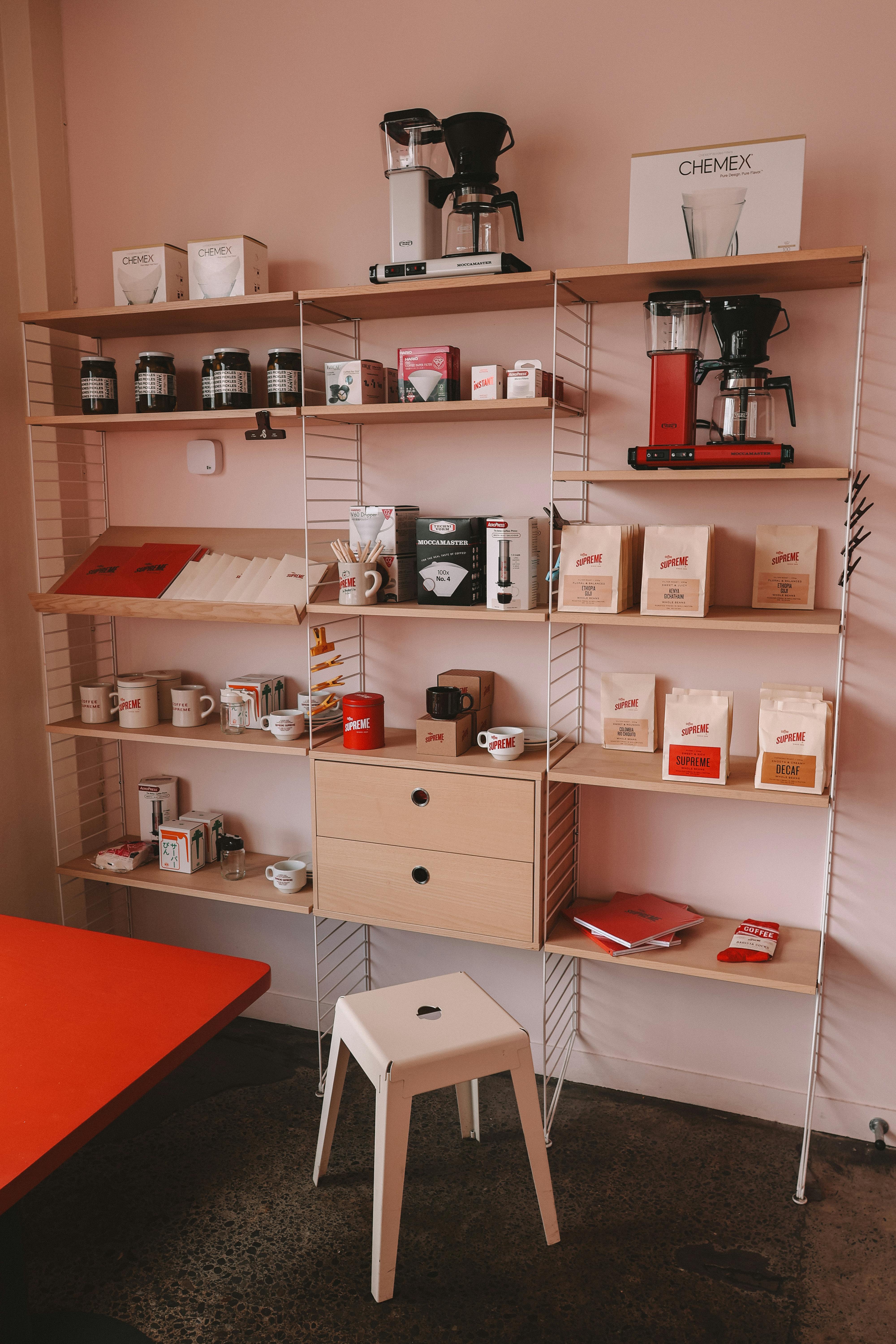 A stylish coffee shop shelf display featuring coffee products and brewers in Christchurch, New Zealand.