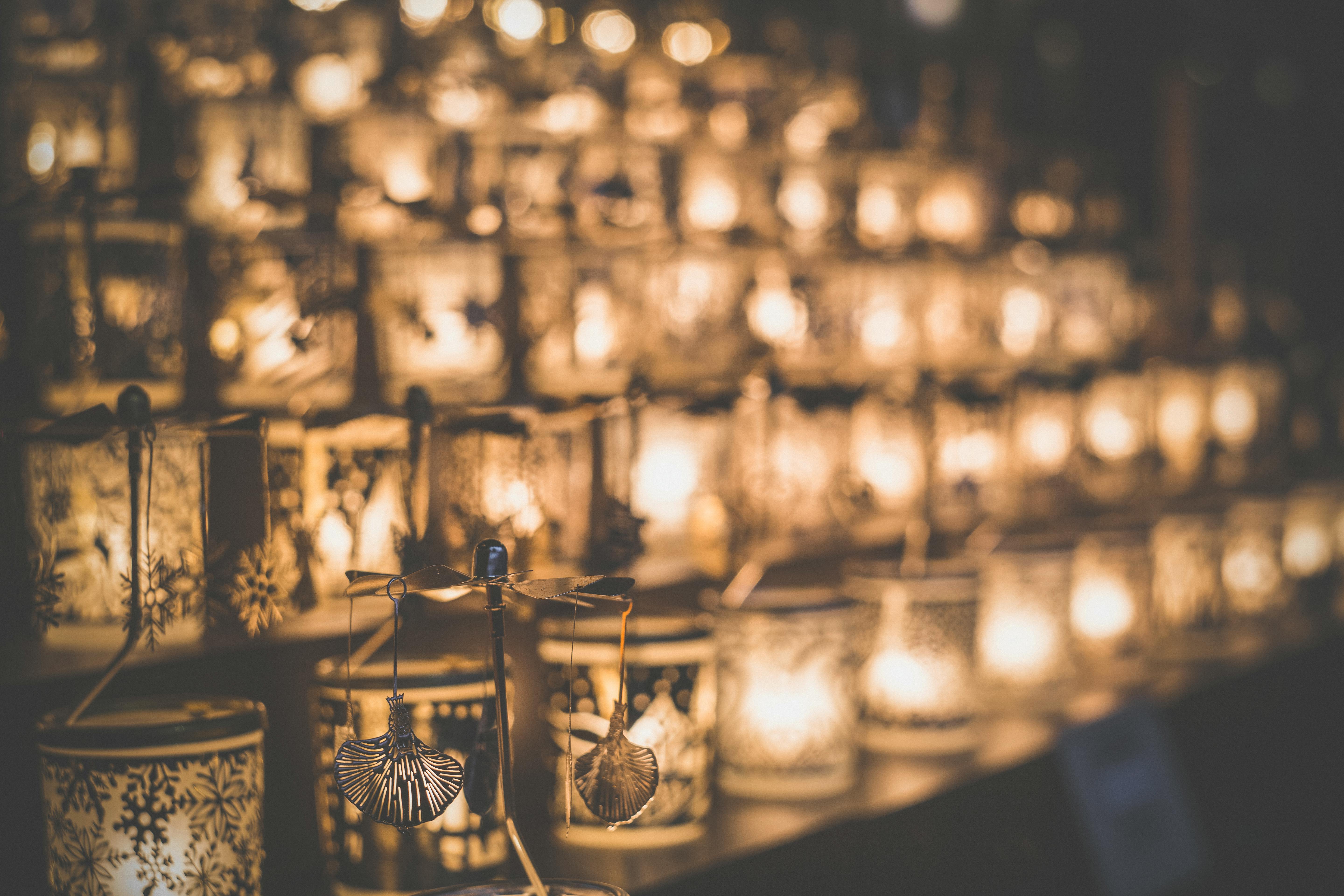 Blurred candlelight atmosphere with decorative lanterns perfect for festive and cozy settings.