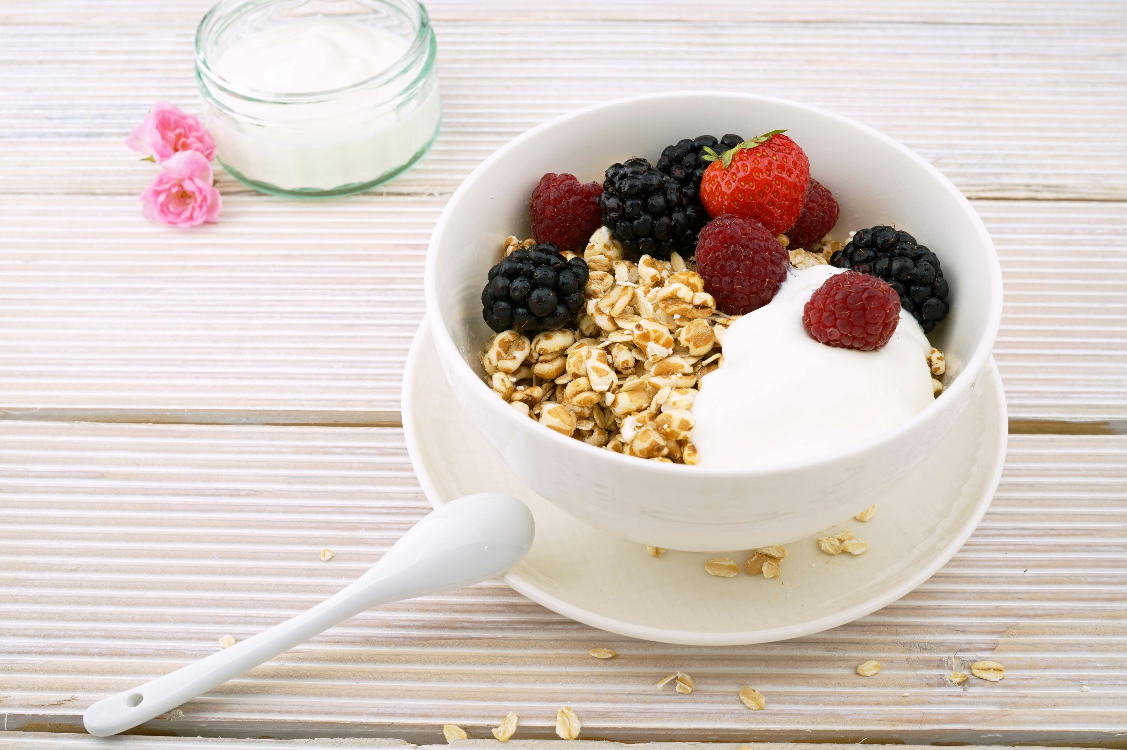 Delicious granola bowl topped with fresh berries and yogurt, perfect for a healthy breakfast.